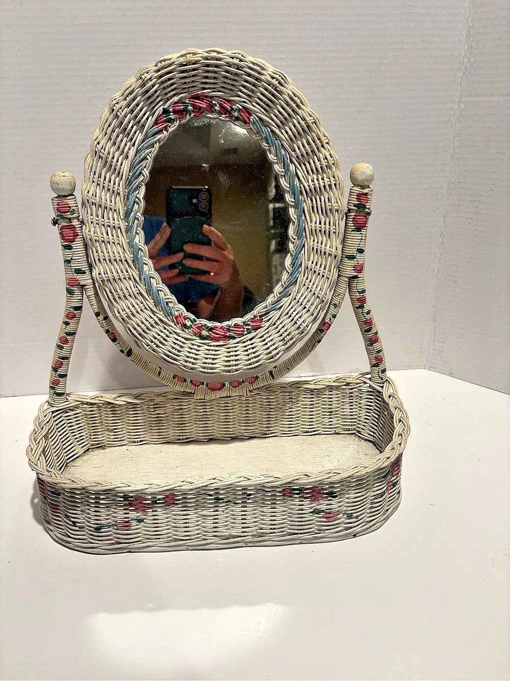 vintage white wicker tabletop vanity swivel mirror with a built-in caddy basket